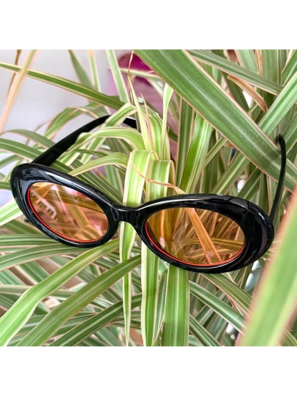 black clout goggles with orange tint